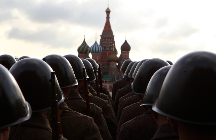 Russian servicemen, dressed in historical uniform, take part in a military parade rehearsal in Red Square in Moscow